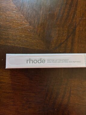 RHODE Peptide Lip Treatment in Pale Pink Box with Silver Logo